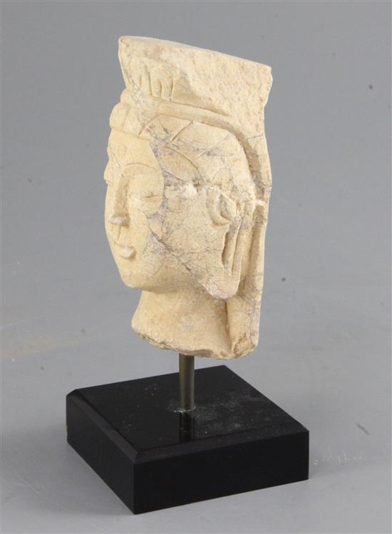 A Chinese marble head of a Bodhisattva, 15th century, in Northern Wei style, height 13cm, modern stand